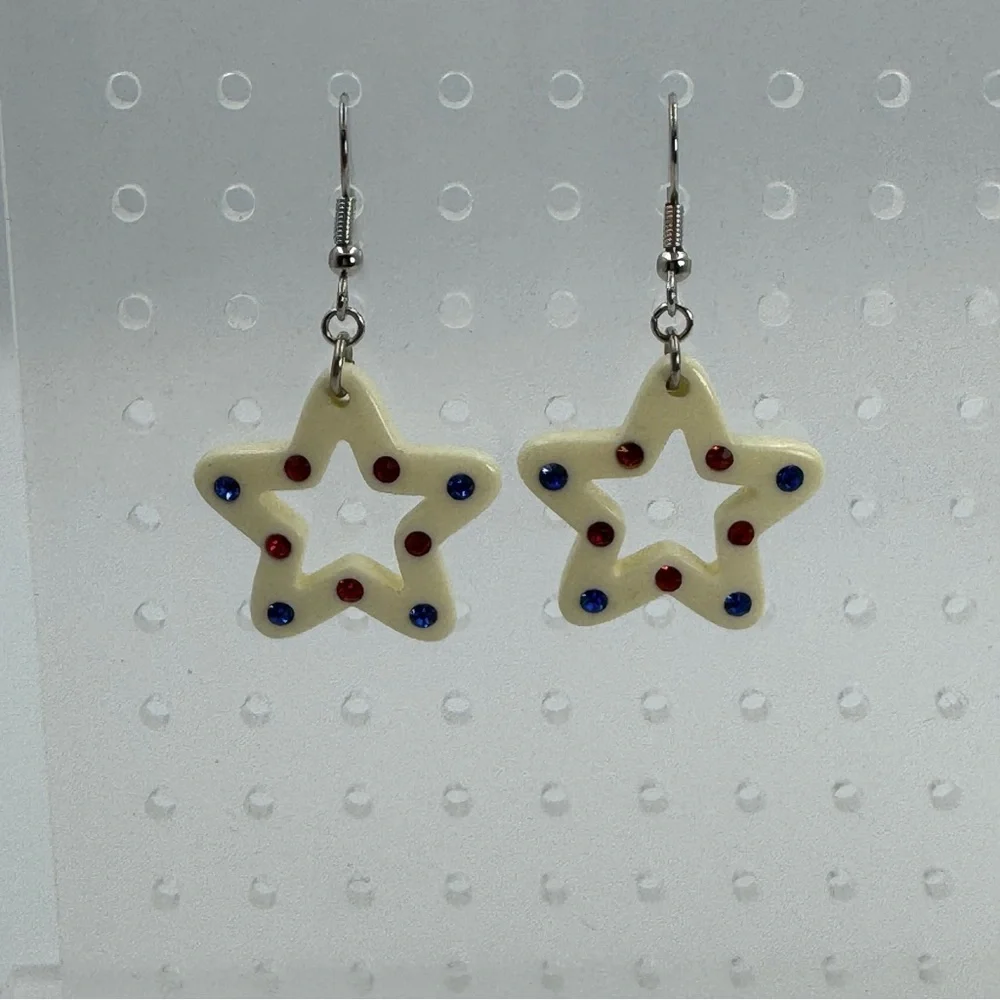 White Plastic Star Earrings With Red and Blue Rhinestones